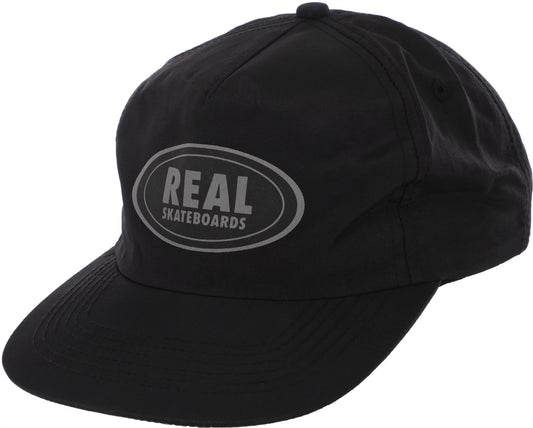 REAL SKATEBOARDS OVAL SNAPBACK CAP BLACK REFLECTIVE